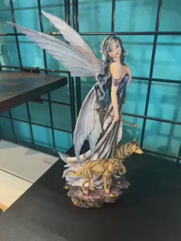 Fairy with wolves statue